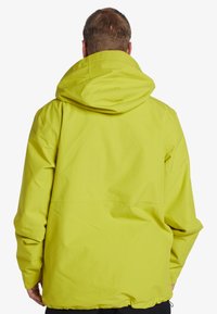 Lime green waterproof jacket with a large hood, spacious cut, and smooth texture. Features a simple, unadorned back design.