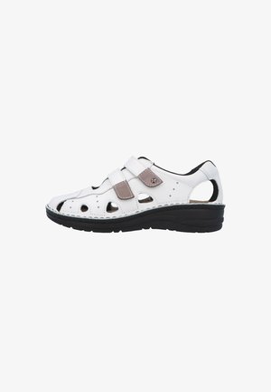 White leather sandal with black sole, two adjustable velcro straps, and multiple cut-out ventilation holes on sides and toe area.