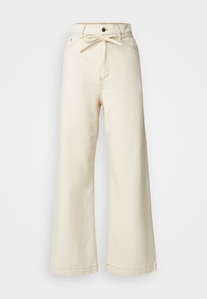 Cremfarbene weite Jeanshose mit hoher Taille, Schleifendetail an der Vorderseite und kontrastierenden Nähten.