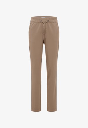 Beige joggers tillverkade av mjukt tyg, med en elastisk midja med dragsko, avsmalnande ben och utan synliga fickor eller mönster.