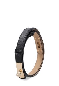 Black leather bracelet with a textured finish, featuring a gold-tone metal clasp and a circular accent. Inside is a smooth beige lining.