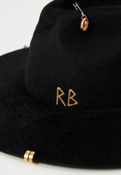 Black felt hat with a wide brim, featuring gold "RB" embellishments and a decorative gold accent. Smooth texture with a structured shape.