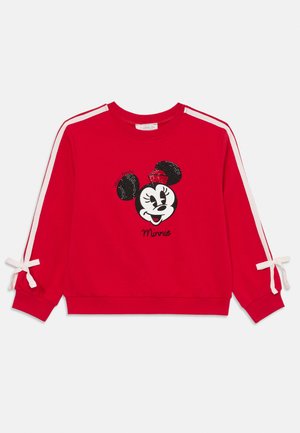 Roter Sweatshirt aus weichem Stoff, mit einem schwarz-weißen Minnie Mouse Design, das mit Glitzerakzenten und weißen Seitestreifen versehen ist. Mit Bändeln an den Ärmeln.