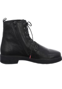 Black leather ankle boot with a smooth texture, featuring a front lace-up design and side zipper. Sturdy black sole with red accent.