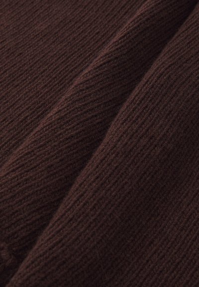 Brown knitted fabric featuring a ribbed texture with visible strands, creating a soft appearance. The material appears warm and cozy.