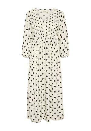 Abito bianco con pois neri, scollo a V, maniche lunghe con polsini elasticizzati, vita arricciata e gonna fluida.