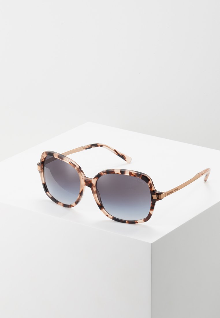 Ochelari de soare din țestoasă cu lentile gri degrade, rame pătrate supradimensionate și detalii metalice rose gold pe tample.
