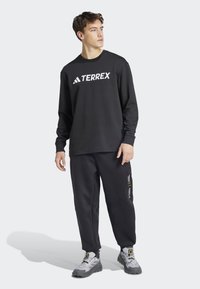 Adidas Terrex NATIONAL GEOGRAPHIC AERO.READY_WARMING PANTS - Āra bikses - black