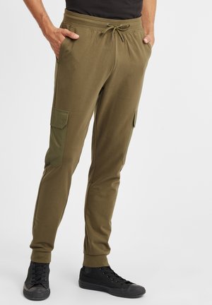 Olivgrüne Jogginghosen aus weichem Stoff, mit einem Kordelzugbund, elastischen Bündchen und zwei Cargotaschen an den Oberschenkeln.