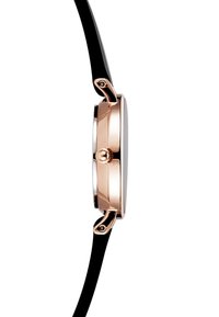 Czarny zegarek z cienkim czarnym paskiem, złotą kopertą i czarną tarczą. Posiada koronkę po boku oraz elegancki, minimalistyczny design.