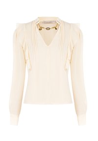 Blusa crema con maniche lunghe, scollo a V e dettagli arricciati. Presenta un dettaglio in catena dorata attorno al collo. Tessuto dalla consistenza liscia.