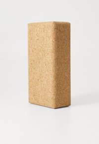 Cork block with a rectangular shape and rounded edges. Natural beige color with a textured surface, showcasing the cork's grain.
