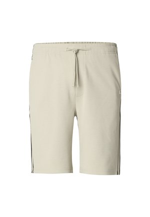 Bēšas šorti no mīksta auduma ar regulējamu auklu jostasvietā, kontrastējošām melnām sānu svītrām un brīvu piegriezumu.