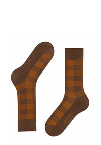 Calzini marroni con un motivo a scacchi in marrone scuro e arancione bruciato. Realizzati in materiale morbido, presentano punte e aperture per caviglia rinforzate.