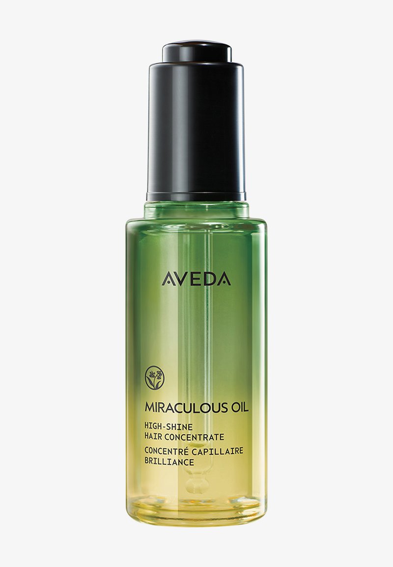Olio Miracoloso Aveda in una bottiglia di vetro trasparente, con un gradiente che va dal verde al giallo e un pompa nera. Presenta il logo e il testo del prodotto sulla parte frontale.