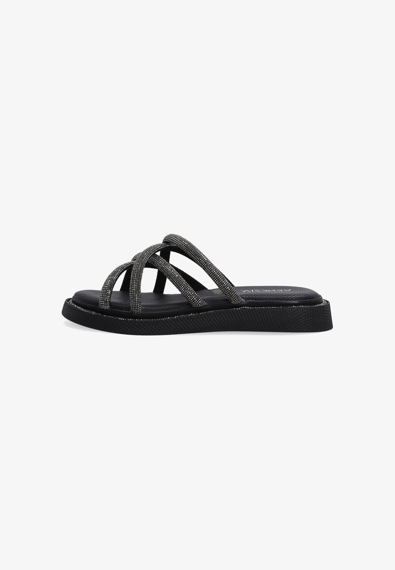 Black slide sandals with crisscrossing straps made of metallic textile. Textured sole and cushioned footbed for support.