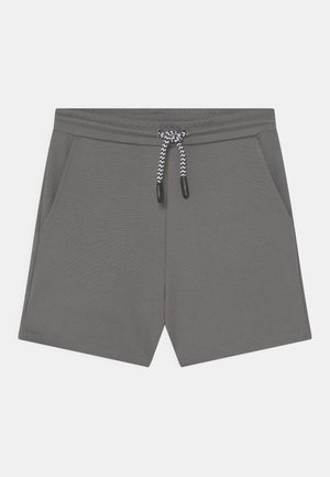 Graue lässige Shorts mit Seitentaschen und einem schwarz-weiß gemusterten Kordelzug am elastischen Bund auf einem weißen Hintergrund.