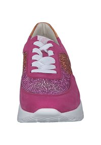 Pink sneaker with glitter accent on the side, white laces, and a textured fabric upper. Features a cushioned white sole for support.