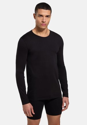 Black long-sleeve t-shirt made of lightweight fabric with a rounded neckline and a simple, fitted design. Smooth texture.