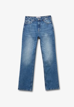 Jeans de mezclilla azul con diseño de pierna recta, ligero desgaste, estilo de cinco bolsillos y una etiqueta en la cinturilla que dice "INSIDE."