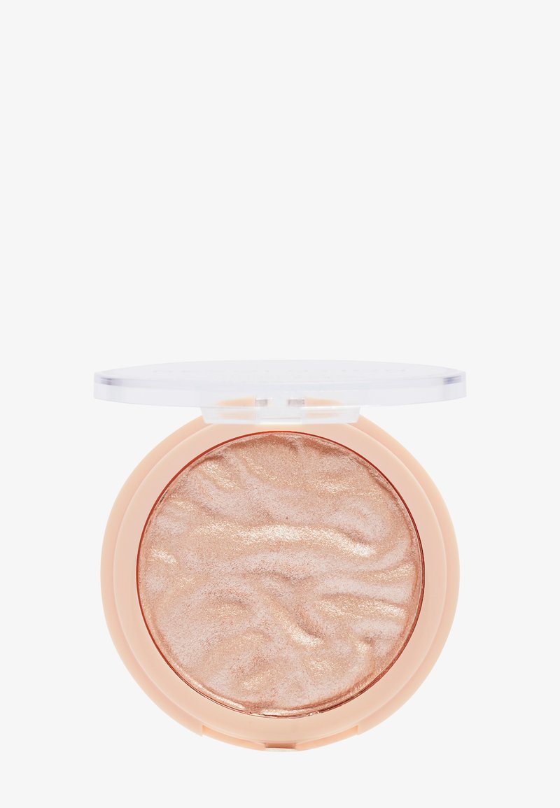 Round compact with a clear lid, containing marbled rose-gold powder. Soft texture, lightweight plastic casing, and smooth surface detail.
