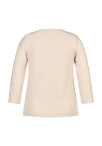 Helles beige Langarmshirt aus weichem Stoff, mit rundem Halsausschnitt und schlichter Gestaltung ohne Muster oder Akzente.