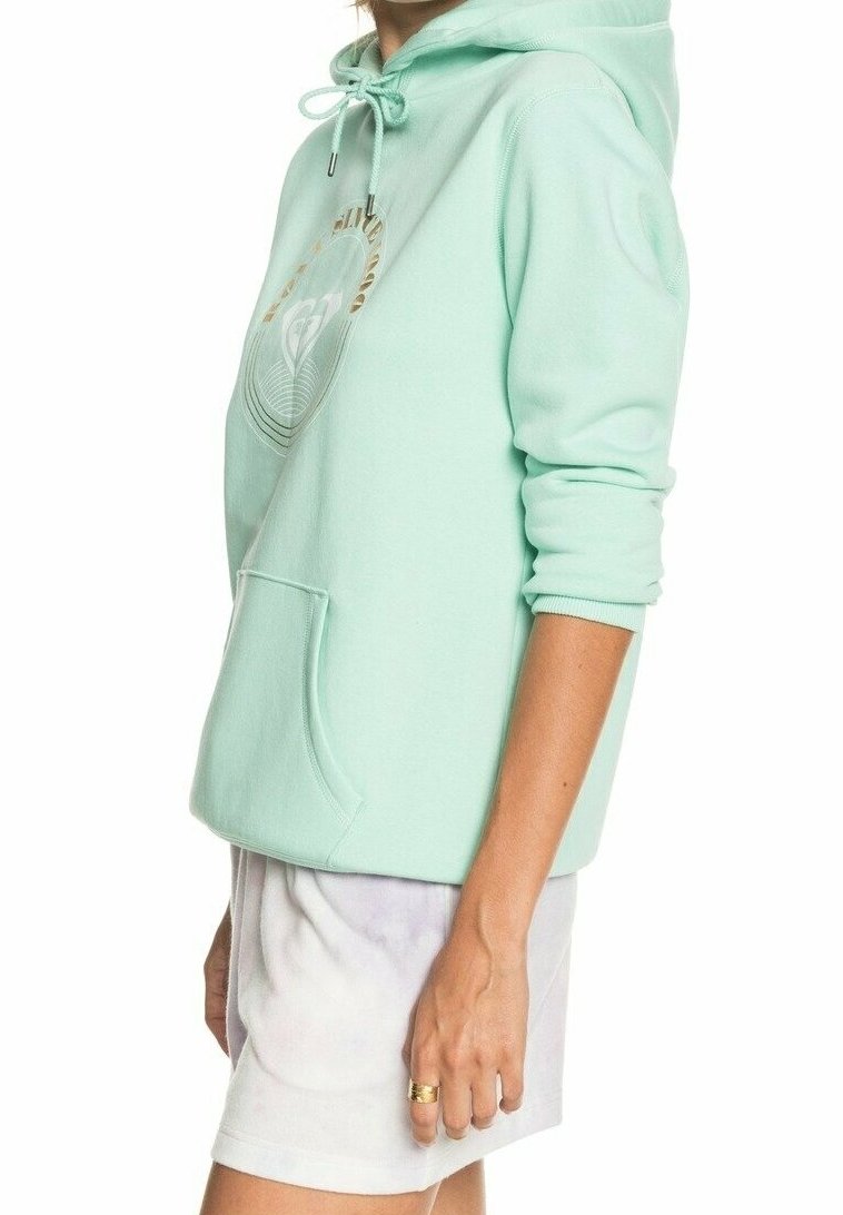 Mátově zelená mikina s kapucí, přední kapsou, nastavitelnou šňůrkou a kulatým grafickým designem na hrudi. Měkká, bavlněná směs.