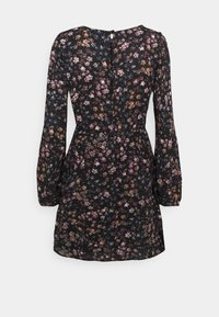 Black dress with floral print in shades of purple, pink, and gold. Long sleeves, round neckline, and a button closure at the back.