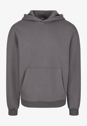 Grijze capuchontrui gemaakt van zachte stof, met een kangoeroezak, geribbelde manchetten en een ontspannen pasvorm. Gladde textuur, eenvoudig ontwerp.