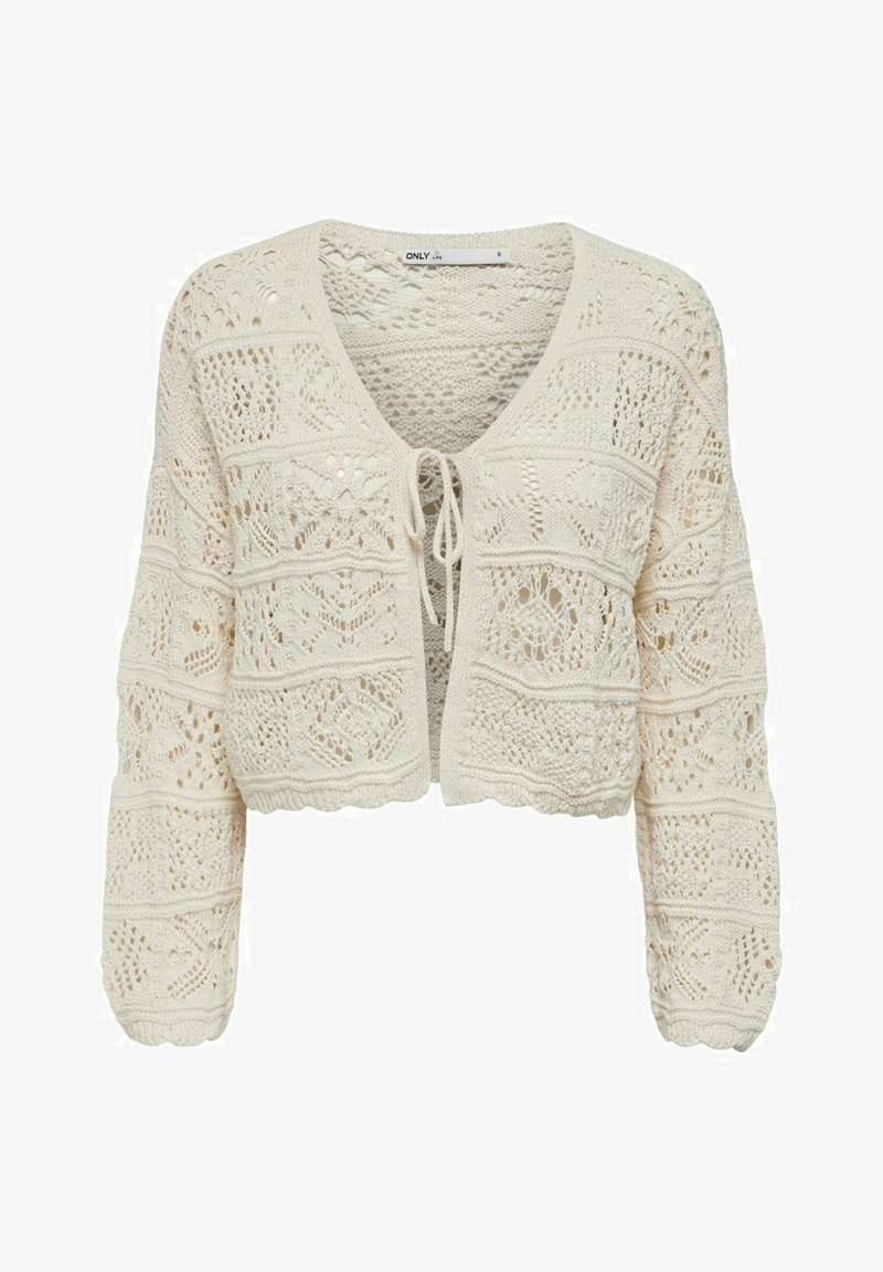 Krémový pletený cardigan s otevřenými vzory, zkráceným střihem a zavazovací šňůrkou v přední části. Dlouhé rukávy s vlnitými okraji.
