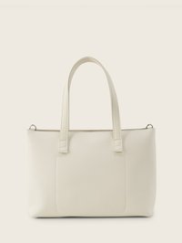 Sac fourre-tout en cuir texturé couleur crème avec deux poignées et une poche avant sur un fond beige.
