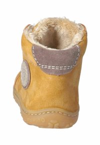 Gelbe Wildleder-Ankle Boots mit beigem Kunstfellfutter, grauen Wildleder-Akzenten, rundem Logo-Detail und Gummisohle mit Naht um den Rand.