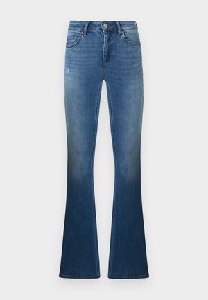 Uppvikta jeans i medelblå denim med blekning vid låren. Har fem fickor, bälteshällor och stängning med framknapp.