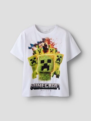 Fehér rövid ujjú póló több zöld Creeper arccal és robbanás grafikával a Minecraft moziból.