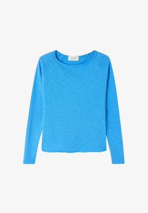 Dug dugmići s dugim rukavima, u vibrantnoj plavoj tkanini s mekim teksturom. Ima opuštenu siluetu i blago zakrivljen rub.