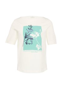 Chemise blanche à manches courtes avec un motif floral rectangulaire teal et le texte "ELEVATED EVERYDAY modern classic" à l'avant.