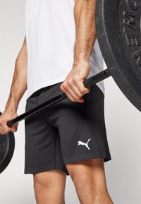 Puma FORM SEAMLESS 7 - Športové šortky - black/white cat