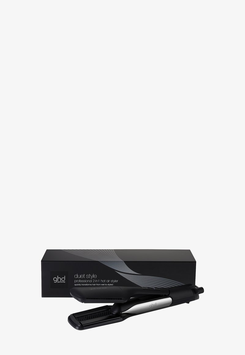 Coiffeur professionnel 2-en-1 noir et argent avec plaques texturées reposant devant sa boîte d'emballage noire.