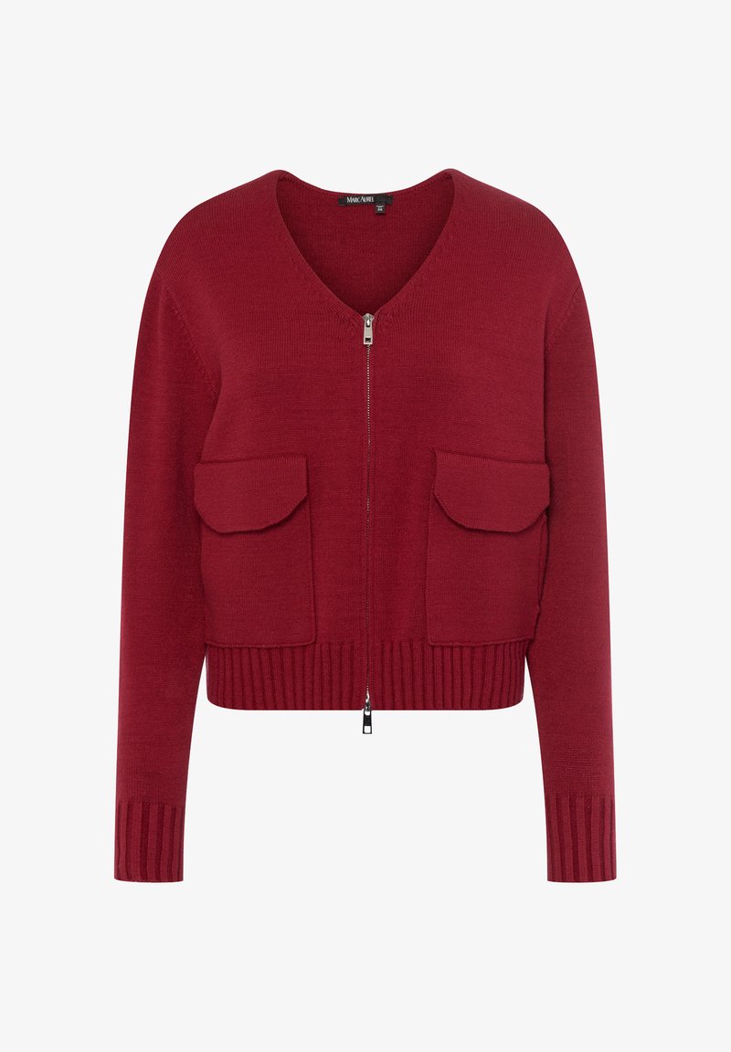 Red knitted cardigan with a v-neck, zip closure, and two front pockets. Ribbed hem and cuffs add texture and structure.