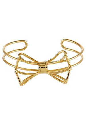 Open armband in goudkleur met een minimalistisch strikje in draadframe design in het midden.