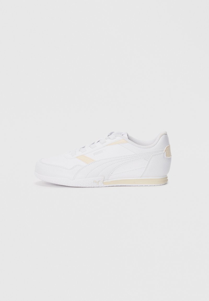 White athletic shoe with a sleek design, synthetic upper, textured rubber sole, and subtle yellow accents on the side and heel.