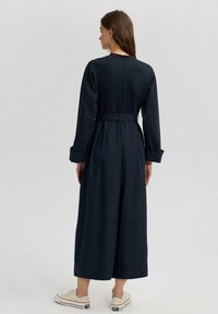 Touché Privé BELTED OVERALLS - Tuta jumpsuit - navy blue