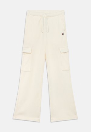 Pantalon cargo ample couleur ivoire avec taille élastique, cordon de serrage, poches latérales à rabat et petit logo sur la cuisse supérieure.