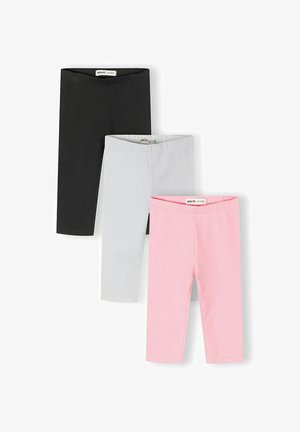 Trois paires de leggings pour enfants pliés en noir, gris clair et rose, disposés verticalement sur un fond blanc.