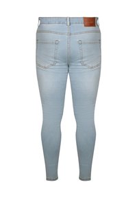 Φωτεινό γαλάζιο τζιν skinny με πίσω τσέπες, θηλιές για ζώνη και καφέ δερμάτινη ετικέτα της μάρκας στην μέση.