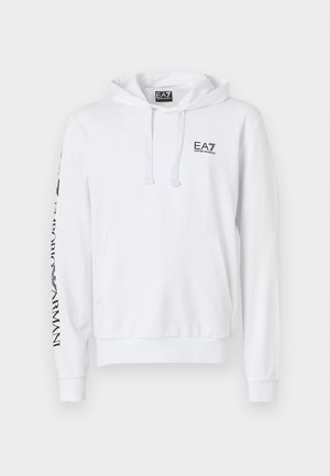 Bela kapuca s sprednjim žepom, kapuco s vrvico in črnim EA7 logotipom na prsih. Potiskano besedilo vzdolž levega rokava. Material iz mešanice bombaža.