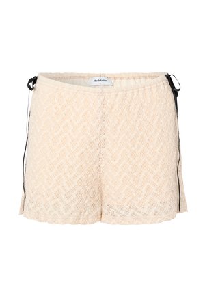 Shorts en dentelle pêche avec taille élastique, liens latéraux et motif chevron. Texture douce et coupe ample pour le confort.