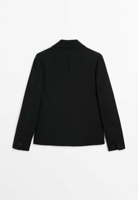 Blazer noir à manches longues avec col, vu de dos, posé à plat sur un fond blanc.