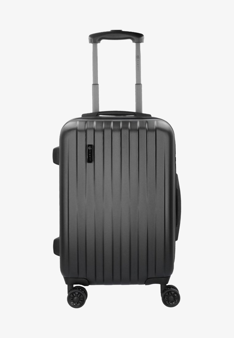 Valise rigide gris foncé avec rainures verticales, poignée télescopique et quatre roues pour une mobilité facile. Dispose d'une poignée latérale et d'un logo.