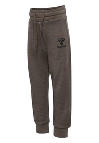 Bruna sweatpants med en strukturerad yta, elastisk midja, dragsnöre och ribbade muddar. Har en svart logotyp på vänster lår.